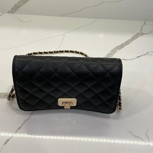 Black quilted crossbody bag. Gold hardware. Great condition.